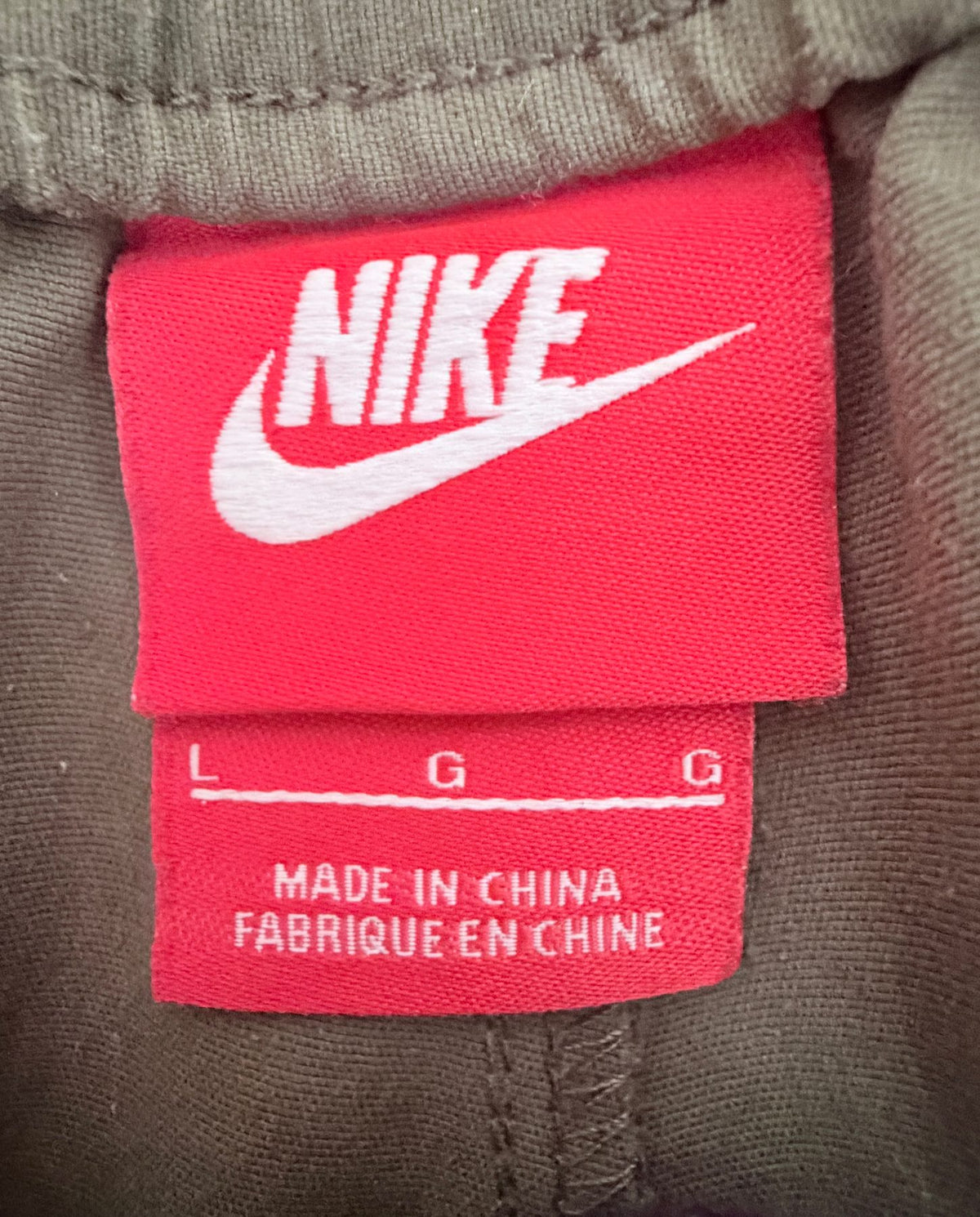 Nike Men's Green Oversized Activewear Pants — brand label